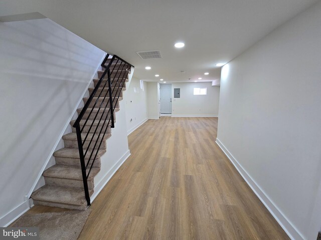 1055 E Cheltenham Ave, Philadelphia, PA 19124 - hallway with recessed lighting, wood finished floors, visible vents, baseboards, and stairs