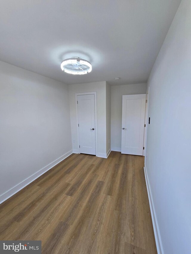1055 E Cheltenham Ave, Philadelphia, PA 19124 - empty room featuring baseboards and dark wood finished floors