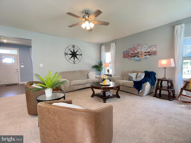 living room featuring ceiling fan and plenty of natural light