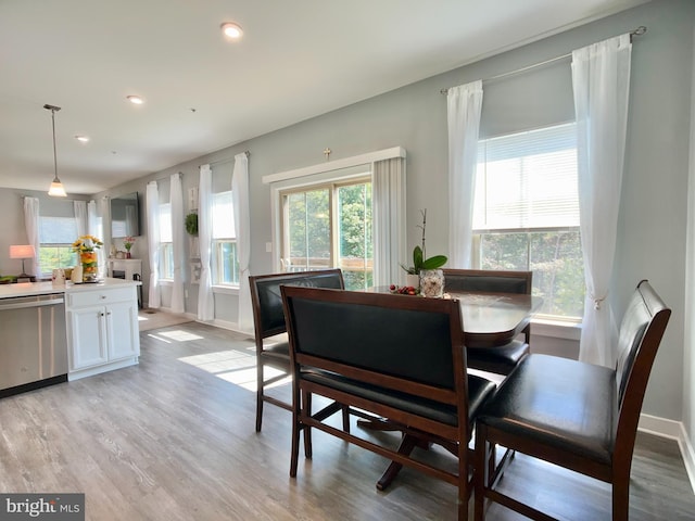 dining room with baseboards, recessed lighting, and light wood-style flooring