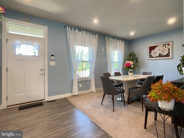 dining space with visible vents, wood finished floors, a wealth of natural light, and recessed lighting