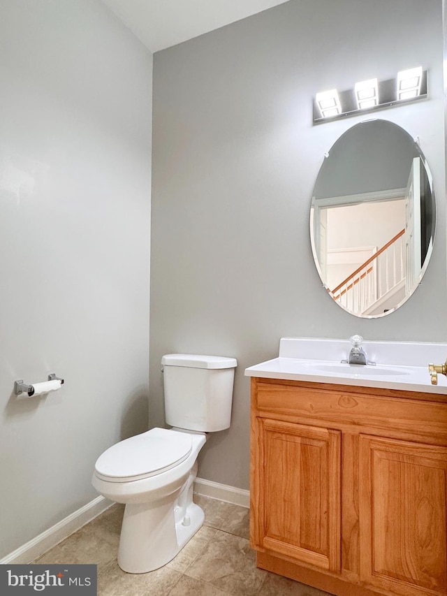 1 Donegal, Newark, DE 19702 - bathroom with toilet, tile patterned floors, vanity, and baseboards
