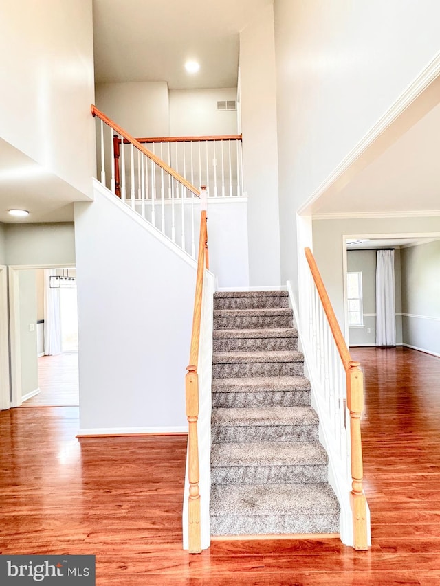 1 Donegal, Newark, DE 19702 - stairway with a high ceiling, visible vents, wood finished floors, and baseboards