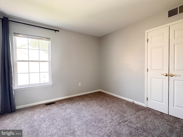 1 Donegal, Newark, DE 19702 - unfurnished room with carpet, visible vents, and baseboards