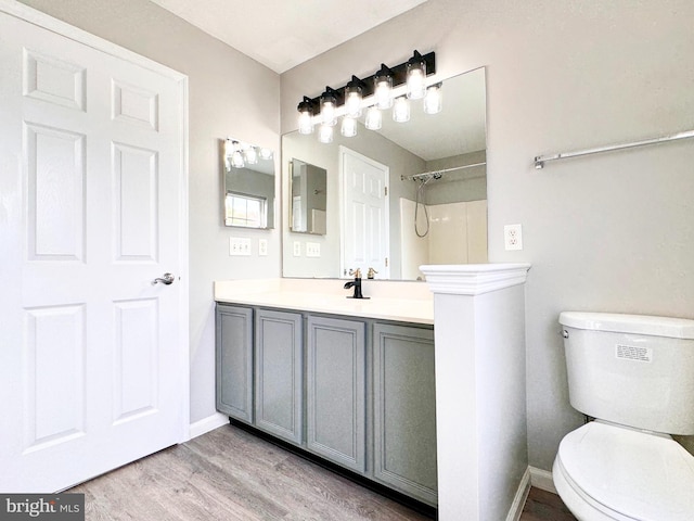 1 Donegal, Newark, DE 19702 - full bath with vanity, toilet, a shower, baseboards, and wood finished floors