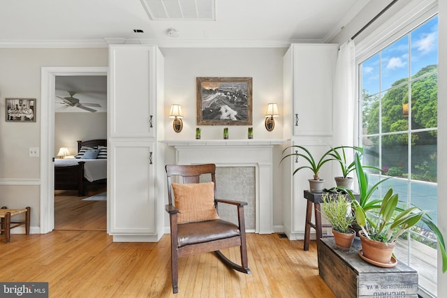 206 Barroll Dr, Chestertown, MD 21620 - living area with light wood-style floors, crown molding, and a ceiling fan