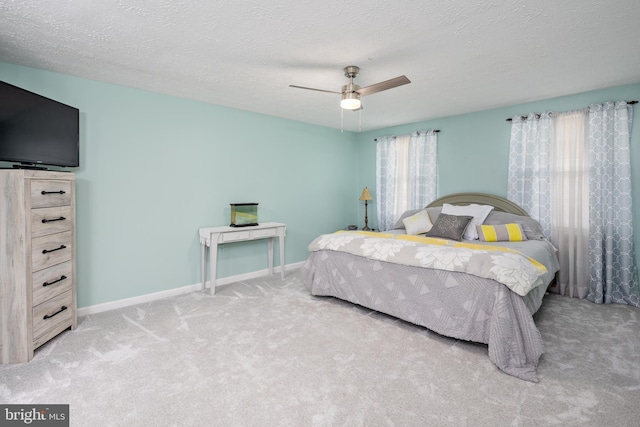 12910 Mayflower Ln, Bowie, MD 20720 - carpeted bedroom with a textured ceiling, ceiling fan, and baseboards
