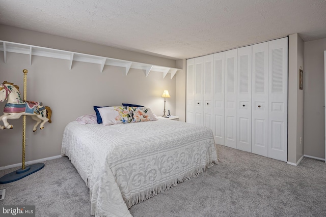 12910 Mayflower Ln, Bowie, MD 20720 - carpeted bedroom with a textured ceiling, baseboards, and a closet