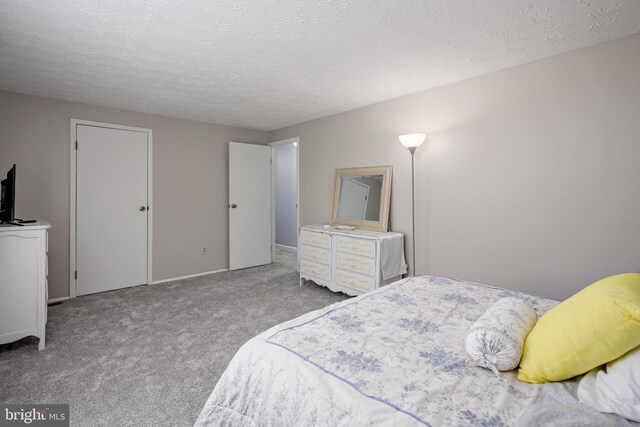 12910 Mayflower Ln, Bowie, MD 20720 - carpeted bedroom with a textured ceiling and baseboards