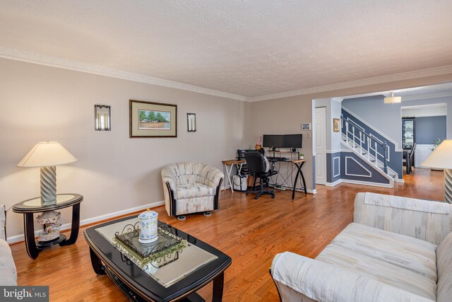 12910 Mayflower Ln, Bowie, MD 20720 - living area with crown molding, a textured ceiling, stairway, and wood finished floors