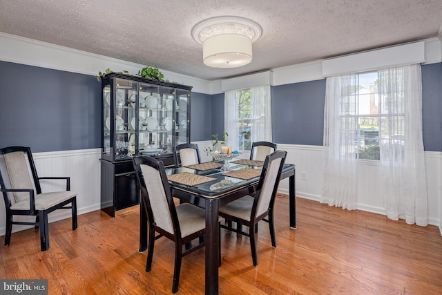 12910 Mayflower Ln, Bowie, MD 20720 - dining space with a wainscoted wall and a textured ceiling