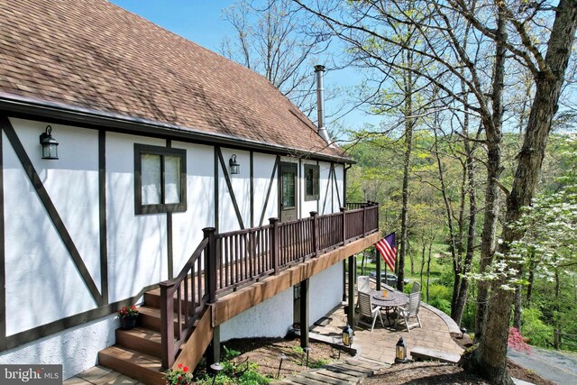 exterior space featuring a patio and stairway