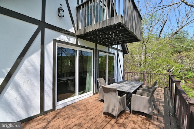 wooden deck with outdoor dining area