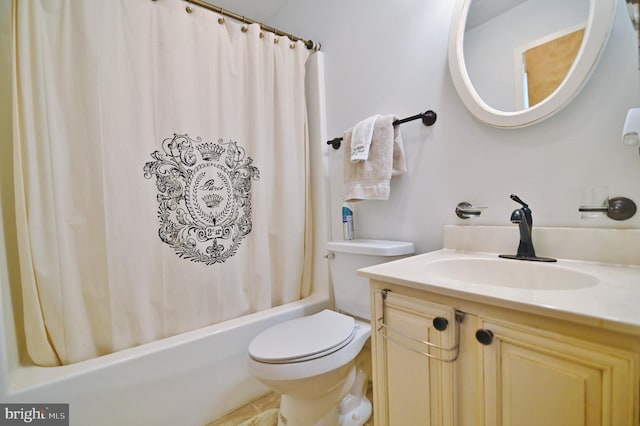 bathroom featuring vanity, shower / tub combo, and toilet