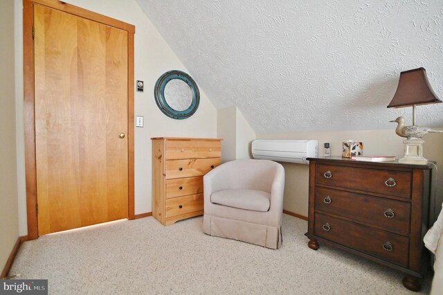 living area featuring baseboards, vaulted ceiling, a textured ceiling, and light colored carpet