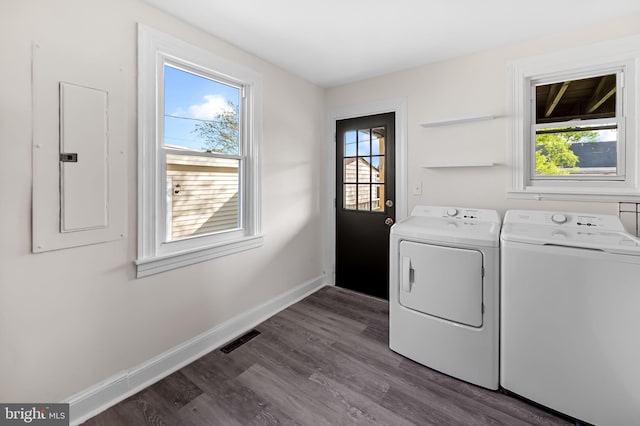 18 Crafton Rd, Baltimore, MD 21221 - clothes washing area featuring washer and dryer, laundry area, dark wood finished floors, baseboards, and visible vents