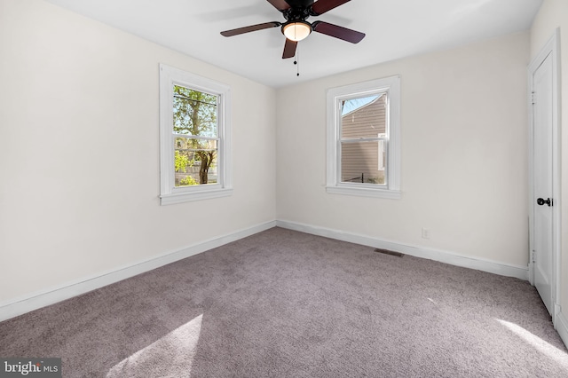 18 Crafton Rd, Baltimore, MD 21221 - unfurnished bedroom with baseboards, multiple windows, and carpet