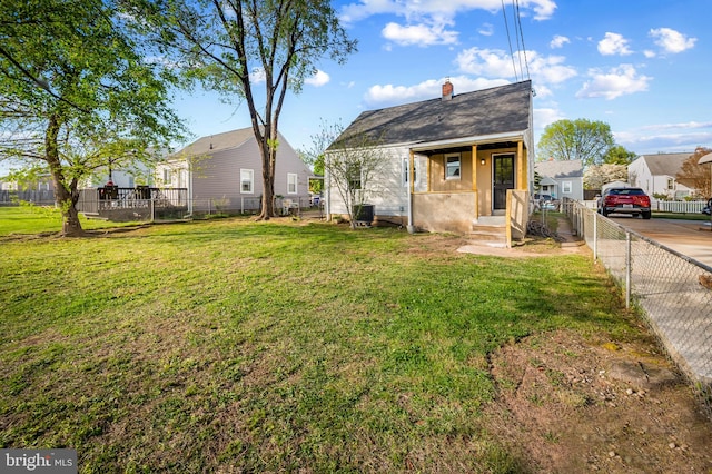 18 Crafton Rd, Baltimore, MD 21221 - exterior space featuring a fenced backyard, a chimney, and a front yard