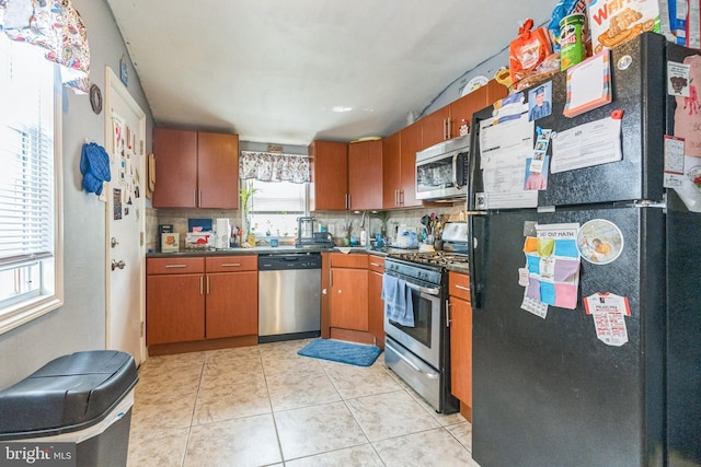 3526 Welsh Rd, Philadelphia, PA 19136 - kitchen featuring dark countertops, stainless steel appliances, light tile patterned flooring, and a sink