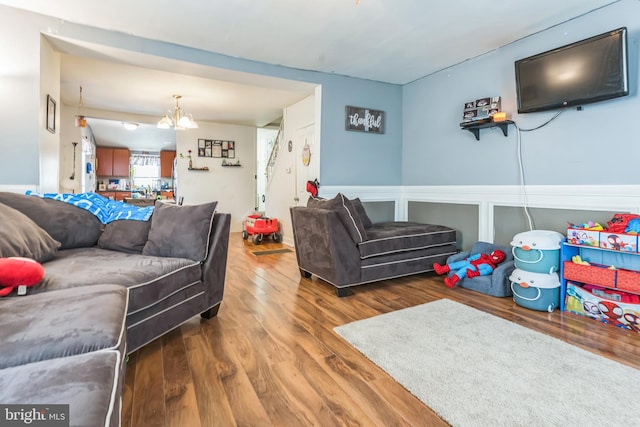 3526 Welsh Rd, Philadelphia, PA 19136 - living room with wainscoting, wood finished floors, and an inviting chandelier