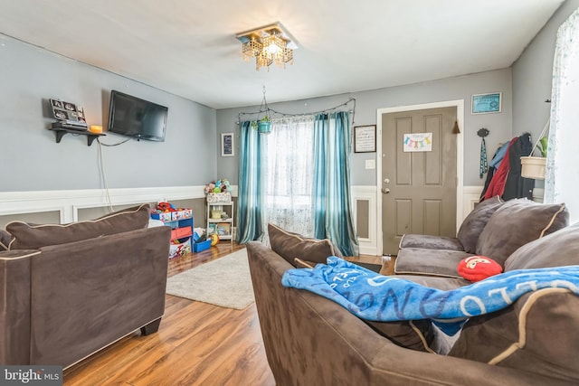 3526 Welsh Rd, Philadelphia, PA 19136 - living area featuring wood finished floors, a wainscoted wall, and an inviting chandelier