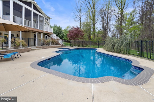view of pool featuring stairway, a patio, fence, and a sunroom
