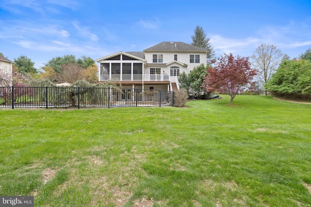 back of house with a lawn, fence, stucco siding, and a sunroom