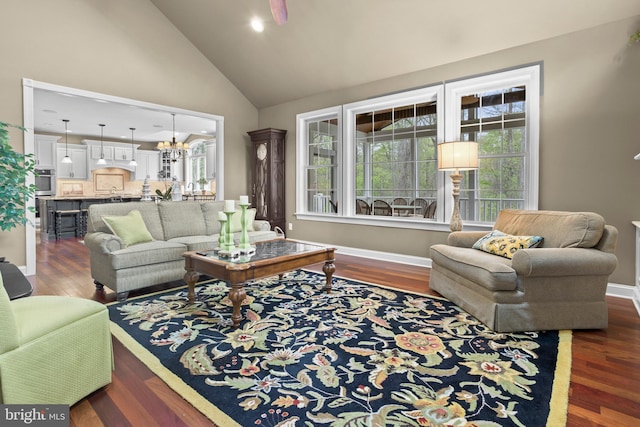 living area with plenty of natural light, baseboards, dark wood-style floors, and high vaulted ceiling