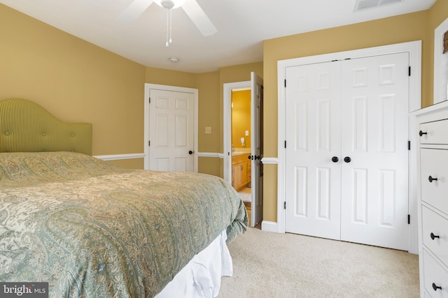 bedroom with a ceiling fan, visible vents, baseboards, a closet, and light carpet