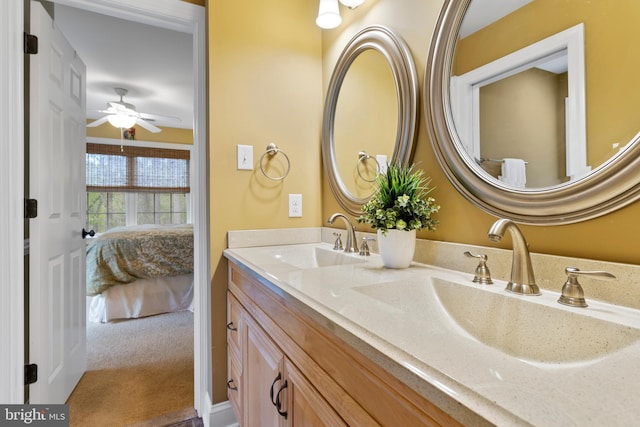 ensuite bathroom with a sink, ensuite bathroom, double vanity, and ceiling fan