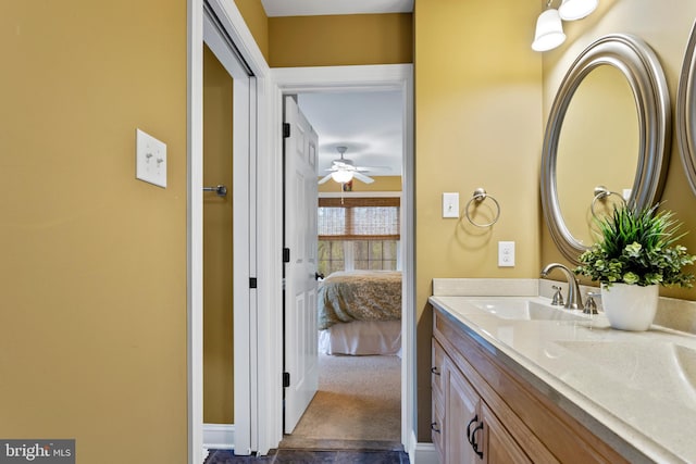 bathroom featuring vanity, ceiling fan, and connected bathroom