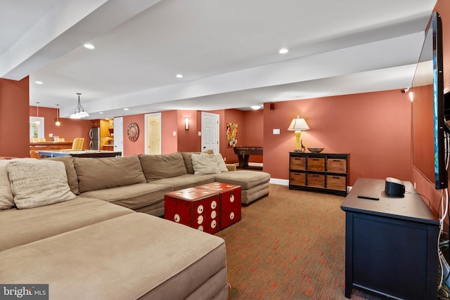 carpeted living area featuring baseboards and recessed lighting