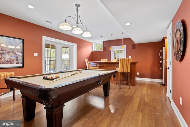 game room with baseboards, billiards, wood finished floors, visible vents, and a bar