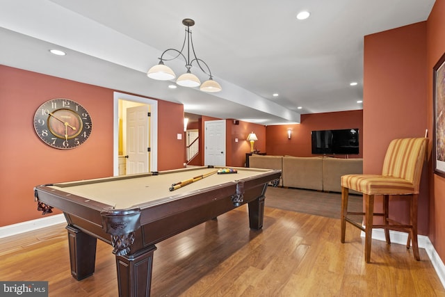 game room with bar, pool table, baseboards, recessed lighting, and light wood-style flooring