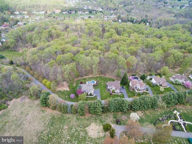 drone / aerial view featuring a view of trees