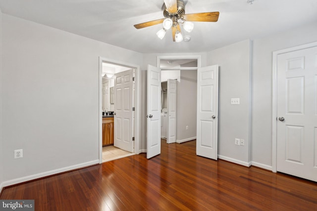 1617 Potomac Greens Dr Unit A, Alexandria, VA 22314 - unfurnished bedroom with wood finished floors, baseboards, ensuite bathroom, and a ceiling fan