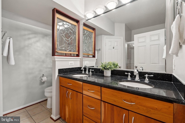1617 Potomac Greens Dr Unit A, Alexandria, VA 22314 - full bathroom with tile patterned flooring, a stall shower, double vanity, toilet, and baseboards