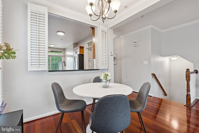 1617 Potomac Greens Dr Unit A, Alexandria, VA 22314 - dining area with wood finished floors, a chandelier, baseboards, and ornamental molding