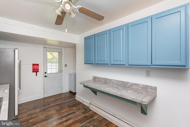 interior space with baseboards, dark wood-style floors, ceiling fan, and baseboard heating