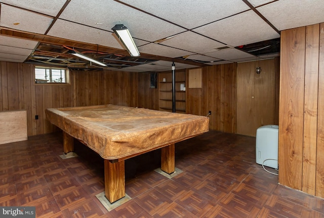 playroom with a paneled ceiling, wood walls, and billiards