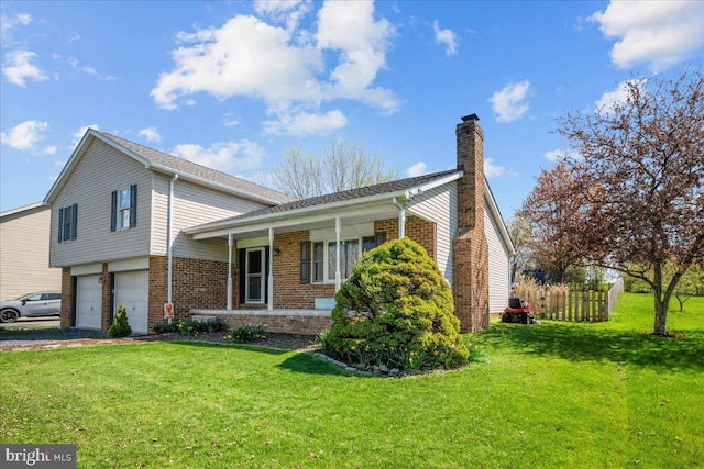 view of front facade with brick siding, a front yard, and a chimney