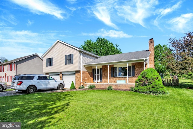 tri-level home featuring covered porch, brick siding, a chimney, and a front lawn