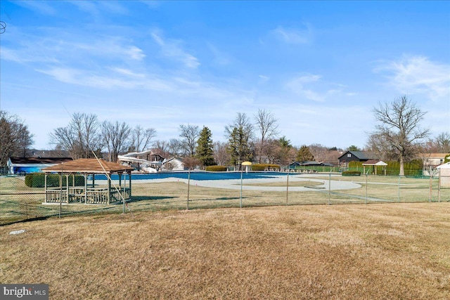 view of home's community with a yard, a gazebo, and fence