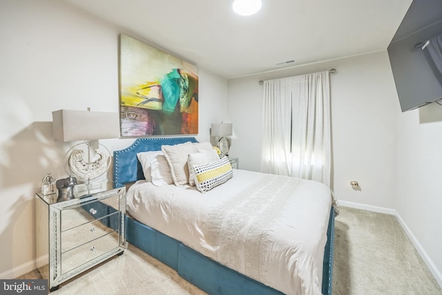 bedroom featuring carpet floors, baseboards, and visible vents