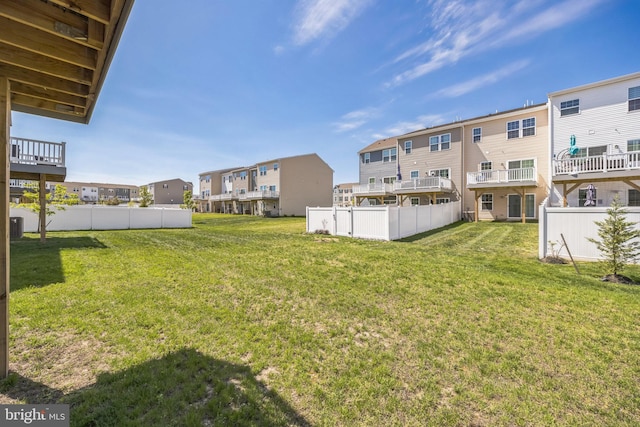 view of yard featuring a residential view and fence