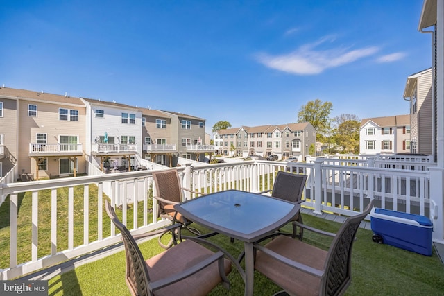 view of wooden balcony with a residential view and a wooden deck