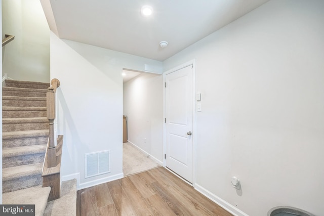 interior space with visible vents, recessed lighting, baseboards, and wood finished floors