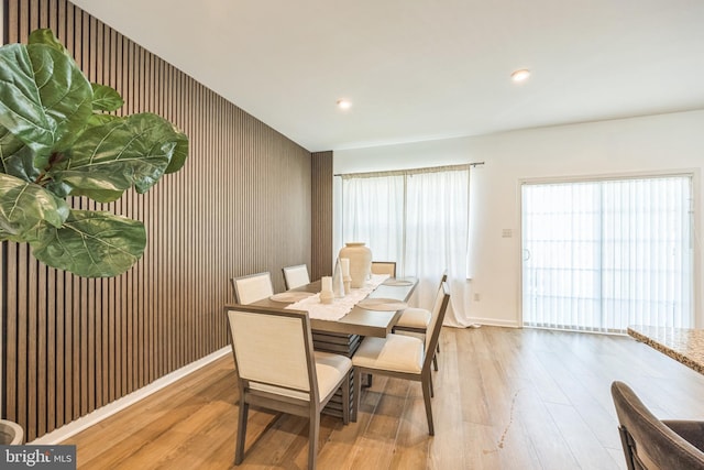 dining room featuring recessed lighting, baseboards, and wood finished floors