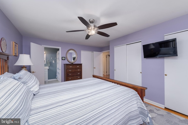 bedroom featuring a ceiling fan, baseboards, and connected bathroom