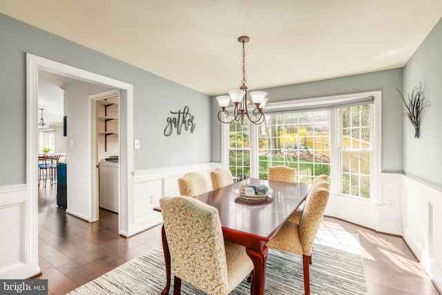 5580 Ann Peake Dr, Fairfax, VA 22032 - dining room with an inviting chandelier, a wainscoted wall, and a decorative wall